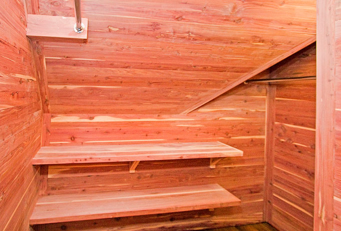 Aromatic cedar closet interior with custom shelving and hanging rods